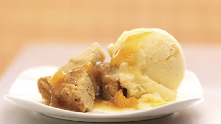 Saffron apricot sorbet and hazelnut crumble on a bed of apricots with saffron dressing